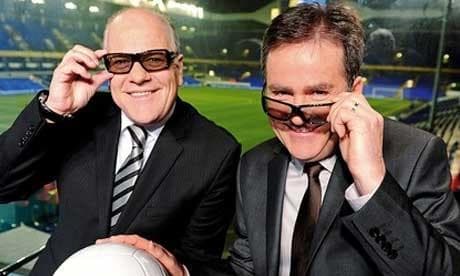 Richard Keys and Andy Gray sharing a light-hearted moment in a stadium